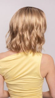 Ava wearing CHARLOTTE by ENVY in SAHARA BLONDE | Softer Dark Blonde with Light Golden Blonde, and features Chestnut Roots
