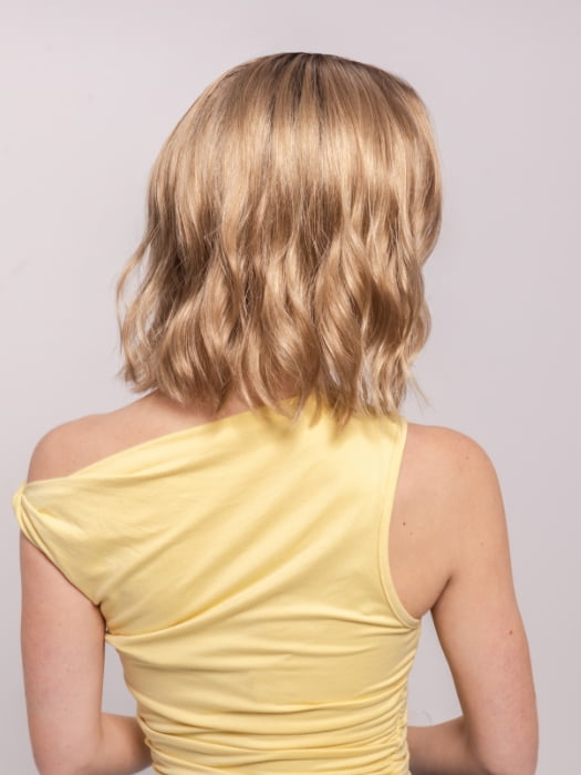 Ava wearing CHARLOTTE by ENVY in SAHARA BLONDE | Softer Dark Blonde with Light Golden Blonde, and features Chestnut Roots