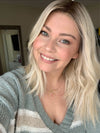Model is wearing DRIVE MONO PART by ELLEN WILLE in PASTEL BLONDE ROOTED 25.22.26 | Pearl Platinum, Dark Ash Blonde, and Medium Honey Blonde mix with a darker root
