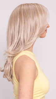 Ava wearing Brooklyn by Belletress in CRUSHED ALMOND BLONDE R | A soft Neutral Light Blonde with a Light and Medium Blended Root Color.