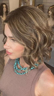 Madeline wearing SPADE by BELLETRESS in TOASTED WALNUT R | Medium Brown Rooted, Ash Brown, Medium Gold Blonde, and Light Brown Blended to perfection
