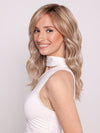 Ava wearing KELLY by BELLETRESS in BUTTERCAKE BLONDE-R | A neutral-warm blonde blend featuring light brown, ash, and lightest blonde tones with natural-looking darker roots for added depth and realism.