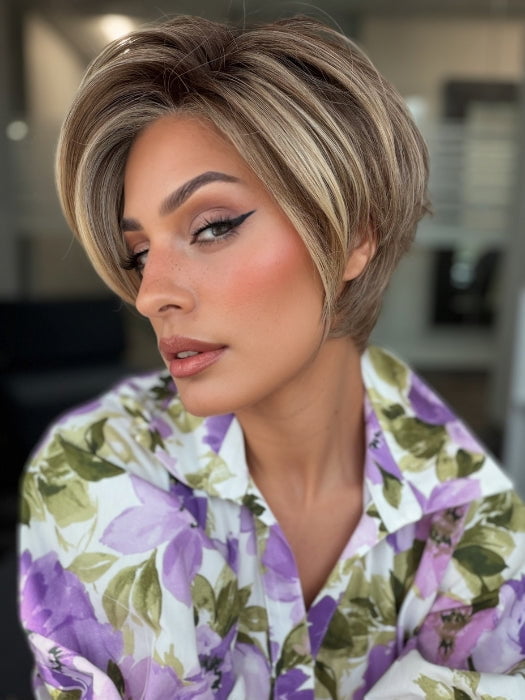 Roxie is wearing POSH PREMIERE by RAQUEL WELCH in RL12/22SS SHADED CAPPUCCINO | Light Golden Brown Evenly Blended with Cool Platinum Blonde Highlights with Dark Roots