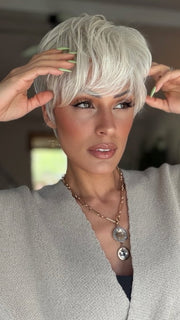 Roxie wearing CELINE by JON RENAU in 60 WINTER SUN | Pure White