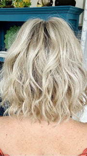 Mel B. @mels.be.ageless wearing JANUARY by JON RENAU in color FS17/101S18 PALM SPRINGS BLONDE | Light Ash Blonde with Pure White Natural Violet Bold Highlights, Shaded with Dark Natural Ash Blonde