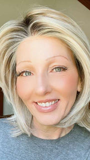 Alicia F. @wigginout wearing BIG TIME by RAQUEL WELCH WIGS in color RL19/23SS SHADED BISCUIT | Light Ash Blonde Evenly Blended with Cool Platinum Blonde with Dark Roots | window lighting