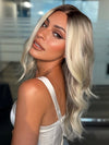 Roxie wearing ESME by RENE OF PARIS in BILLIONAIRE-BLOND | A Rich Mocha Root melting into Beige, Ash, and Cream Blond tones. Face-framing cream and White Blond highlights