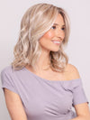 Ava wearing BRADSHAW by BELLETRESS in MILKSHAKE BLONDE R | A mixture of Light Sandy Brown, Highlighted with Light Ash Blonde with a Hint of Light Platinum Blonde with a Medium Root Color