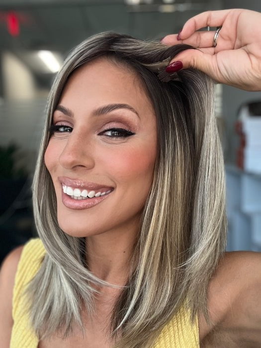 Roxie is wearing UNMATCHED 12" by RAQUEL WELCH in SS17/23 ICED LATTE MACCHIATO | Honey Blonde shaded with Cool Blonde with Dark Roots