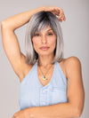 ROXIE wearing CARLEY by ENVY in STERLING SHADOW | Medium Salt-and-Pepper Grey with Darker Brown Roots
