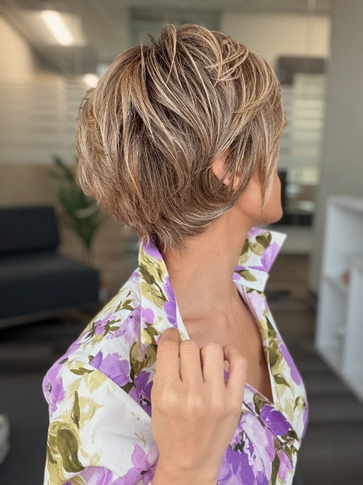 Roxie is wearing POSH PREMIERE by RAQUEL WELCH in RL12/22SS SHADED CAPPUCCINO | Light Golden Brown Evenly Blended with Cool Platinum Blonde Highlights with Dark Roots