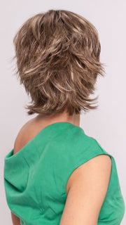 Roxie wearing TREND SETTER by RAQUEL WELCH in SS12/22 SHADED CAPPUCCINO | Light Golden Brown Evenly Blended with Cool Platinum Blonde Highlights and Dark Roots