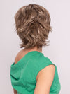 Roxie wearing TREND SETTER by RAQUEL WELCH in SS12/22 SHADED CAPPUCCINO | Light Golden Brown Evenly Blended with Cool Platinum Blonde Highlights and Dark Roots