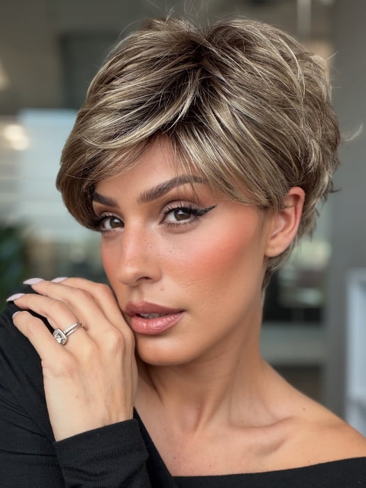Roxie wearing SPARKLE PETITE by RAQUEL WELCH in SS12/22 SHADED CAPPUCCINO | Light Golden Brown Evenly Blended with Cool Platinum Blonde Highlights and Dark Roots