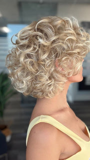 Roxie is wearing BOUYANT by GABOR in GL14-22SS SS SANDY BLONDE | Dark golden blonde base blends into multi-dimensional tones of medium gold blonde and light beige blonde