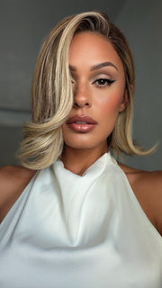 Roxie wearing EURO CHIC by TRESSALLURE in EL12/22/8 | Light Golden Brown Evenly Blended with Platinum Blonde Highlights with Medium Brown Roots