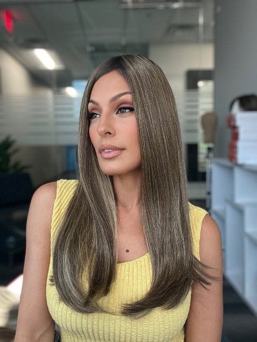 Roxie is wearing UNMATCHED 18" by RAQUEL WELCH in SS9/24 ICED CAFÉ LATTE | Dark Brown shaded with Golden Brown