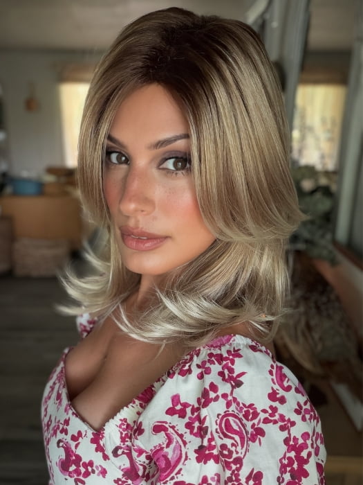 Roxie wearing HARLOW by NORIKO in MELTED-MARSHMALLOW | Subtly Warm Dark Sandy Blonde Blend with Medium Brown Roots and Light Ash Blonde Tips and Highlights