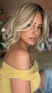Roxie wearing BRADSHAW by BELLETRESS in MILKSHAKE BLONDE R | A mixture of Light Sandy Brown, Highlighted with Light Ash Blonde with a Hint of Light Platinum Blonde with a Medium Root Color
