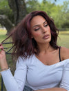 Roxie wearing SMOOTH WAVEZ by RENE OF PARIS in DUSTY-ROSE | Medium Coral Red Base with Dark Brown Roots