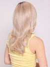 Ava wearing Brooklyn by Belletress in CRUSHED ALMOND BLONDE R | A soft Neutral Light Blonde with a Light and Medium Blended Root Color.