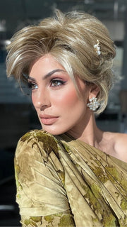 ROXIE wearing CAPTIVATING CANVAS by RAQUEL WELCH in RL13/88 Golden Pecan | Neutral Medium Blonde With Pale Honey Blonde Highlights