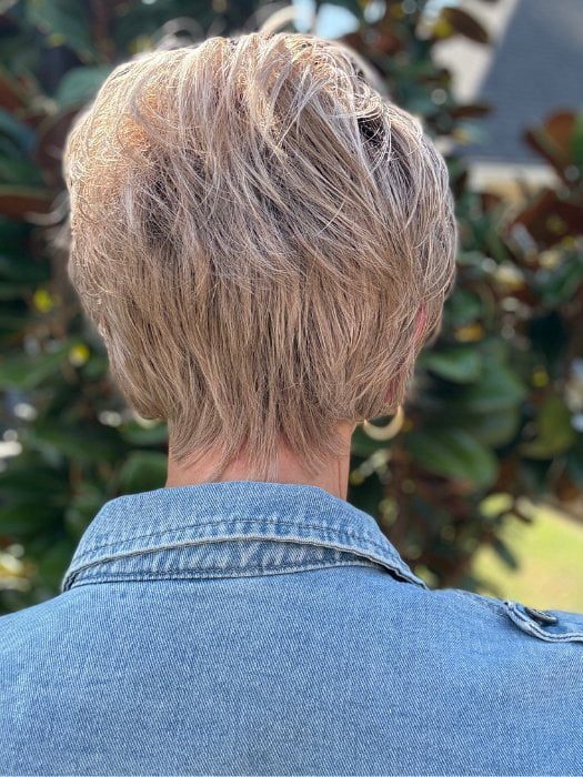 Eileen wearing SPENCER by BELLETRESS in BUTTERCAKE BLONDE-R | A neutral-warm blonde blend featuring light brown, ash, and lightest blonde tones with natural-looking darker roots for added depth and realism.