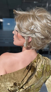 ROXIE wearing CAPTIVATING CANVAS by RAQUEL WELCH in RL13/88 Golden Pecan | Neutral Medium Blonde With Pale Honey Blonde Highlights