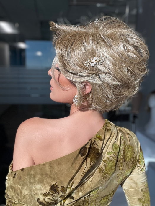 ROXIE wearing CAPTIVATING CANVAS by RAQUEL WELCH in RL13/88 Golden Pecan | Neutral Medium Blonde With Pale Honey Blonde Highlights