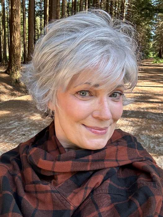 Mel B. @mels.be.ageless wearing VOLTAGE LARGE by RAQUEL WELCH WIGS in color RL51/61 ICED GRANITA | Lightest Grey Progresses to a Deep Grey at the Nape