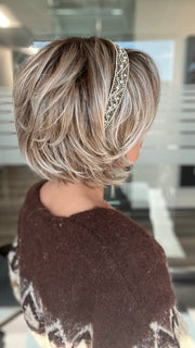 ROXIE wearing ZEAL by NORIKO in MELTED-MARSHMALLOW | Subtly Warm Dark Sandy Blonde Blend with Medium Brown Roots and Light Ash Blonde Tips and Highlights