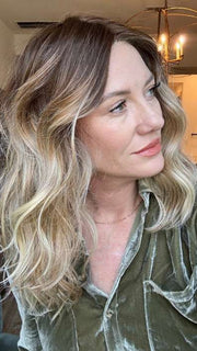 Jenny B. @thewiggygirl wearing BALAYAGE BEAUTY by RAQUEL WELCH WIGS in color RL8/24OM | Medium brown blended roots that transition into a golden blonde ombré from midlength to the ends