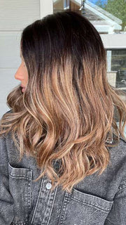 Jenna @jenna_fail wearing BALAYAGE BEAUTY by RAQUEL WELCH WIGS in color RL4/15OM | Dark brown blended roots that transition into a natural blonde ombré from midlength to the ends
