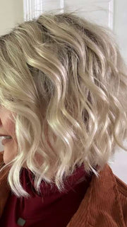 Marcie @wig.obsessed wearing HAVEN by ESTETICA in color SUNLIT-BLONDE | Soft Blend of Sandy Blonde, Lightest Blonde and Iced Blonde with a Light Golden Brown Root | indoor lighting