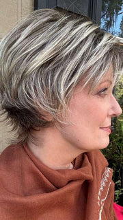 Mel B. @mels.be.ageless wearing COCO by RENE OF PARIS in color FROSTI-BLONDE | Platinum Blonde and Light Ash Brown evenly blended | outdoor lighting
