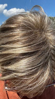 Mel B. @mels.be.ageless wearing COCO by RENE OF PARIS in color FROSTI-BLONDE | Platinum Blonde and Light Ash Brown evenly blended | outdoor lighting
