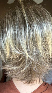 Mel B. @mels.be.ageless wearing COCO by RENE OF PARIS in color FROSTI-BLONDE | Platinum Blonde and Light Ash Brown evenly blended | outdoor lighting
