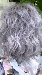 Marcie Mertz @wig.obsessed wearing BREEZY WAVEZ by RENE OF PARIS in color LUNAR-HAZE | Periwinkle Base with Off-Black Roots
