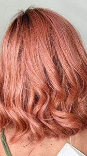 Kristyna @kristynamoore wearing PANACHE WAVEZ by RENE OF PARIS in color DUSTY-ROSE | Medium Coral Red Base with Dark Brown Roots