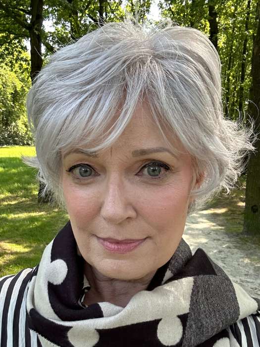 Mel B. @mels.be.ageless wearing VOLTAGE ELITE by RAQUEL WELCH WIGS in color R56/60 SILVER MIST | Lightest Gray with 20% Medium Brown Evenly Blended with Pure White