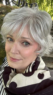 Mel B. @mels.be.ageless wearing VOLTAGE ELITE by RAQUEL WELCH WIGS in color R56/60 SILVER MIST | Lightest Gray with 20% Medium Brown Evenly Blended with Pure White