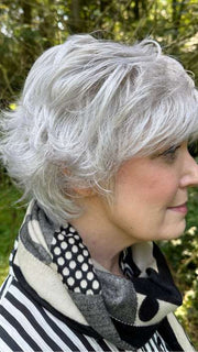 Mel B. @mels.be.ageless wearing VOLTAGE ELITE by RAQUEL WELCH WIGS in color R56/60 SILVER MIST | Lightest Gray with 20% Medium Brown Evenly Blended with Pure White