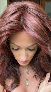 Jenna Fail @jenna_fail wearing BEACH WAVE MAGIC by TRESSALLURE in color 10/130R | Bright Red with Medium Brown roots