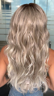 Roxie wearing ESME by RENE OF PARIS in BILLIONAIRE-BLOND | A Rich Mocha Root melting into Beige, Ash, and Cream Blond tones. Face-framing cream and White Blond highlights