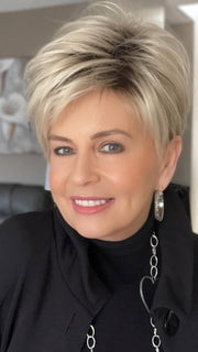 Donna @style.me.ageless wearing TIFFANY by ENVY BY ALAN EATON in color SILKY BEIGE | Light Platinum Blonde with Dark Brown Roots