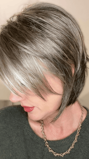 Jenny B. @thewiggygirl wearing REESE by NORIKO in color SANDY SILVER | Medium Brown Transitionally Blending to Silver and Dramatic Silver Bangs