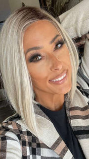 Nichole @nichole.alee wearing CURRENT EVENTS by RAQUEL WELCH WIGS in color RL16/22SS SHADED ICED SWEET CREAM | Pale Blonde with Slight Platinum Highlighting with Dark Roots
