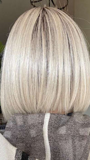 Nichole @nichole.alee wearing CURRENT EVENTS by RAQUEL WELCH WIGS in color RL16/22SS SHADED ICED SWEET CREAM | Pale Blonde with Slight Platinum Highlighting with Dark Roots
