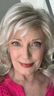 Mel B. @mels.be.ageless wearing TRESS by RAQUEL WELCH WIGS in color R23S GLAZED VANILLA | Cool Platinum Blonde with Almost White Highlights
