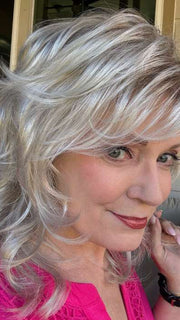 Mel B. @mels.be.ageless wearing TRESS by RAQUEL WELCH WIGS in color R23S GLAZED VANILLA | Cool Platinum Blonde with Almost White Highlights
